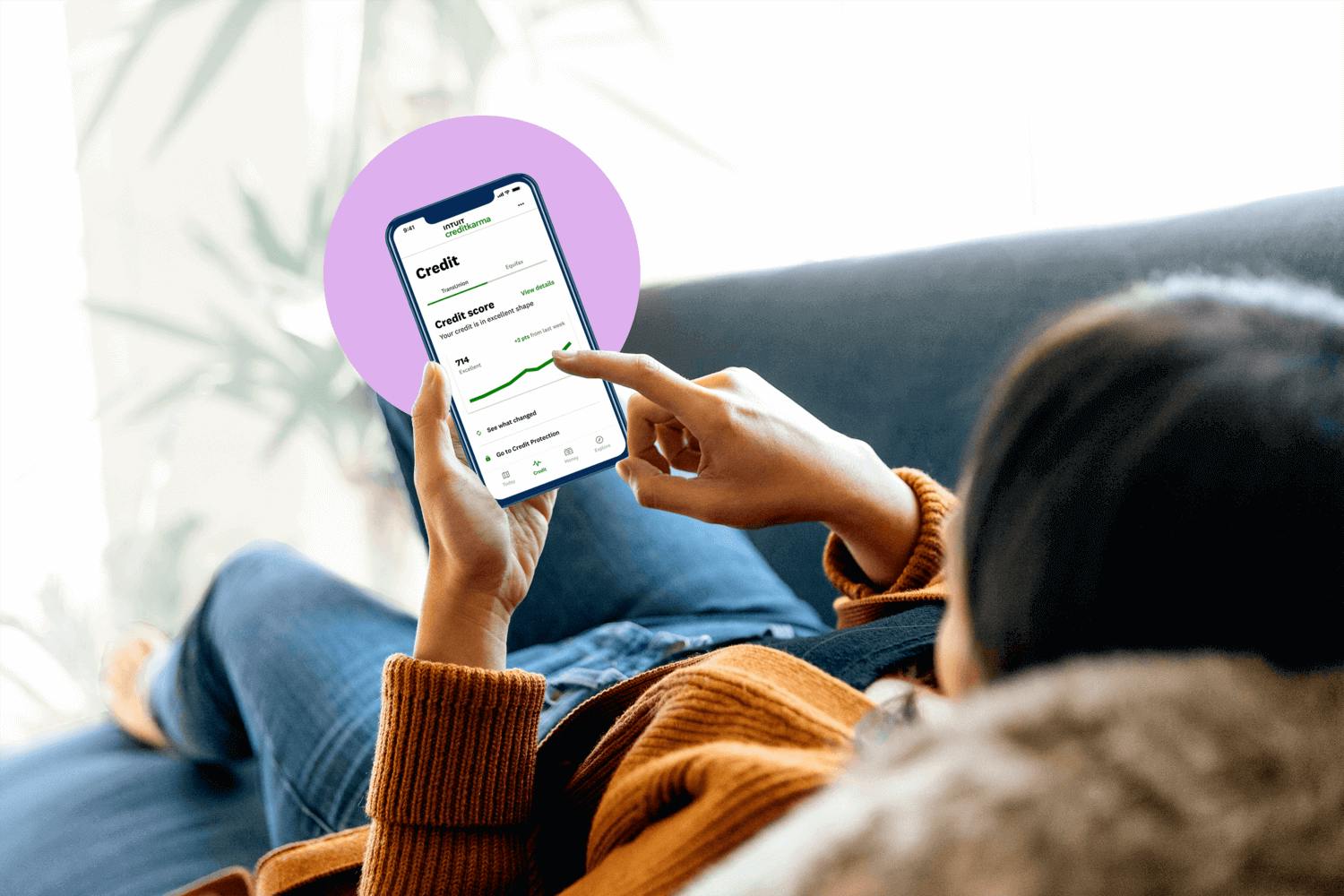 person scrolling through Credit Karma app